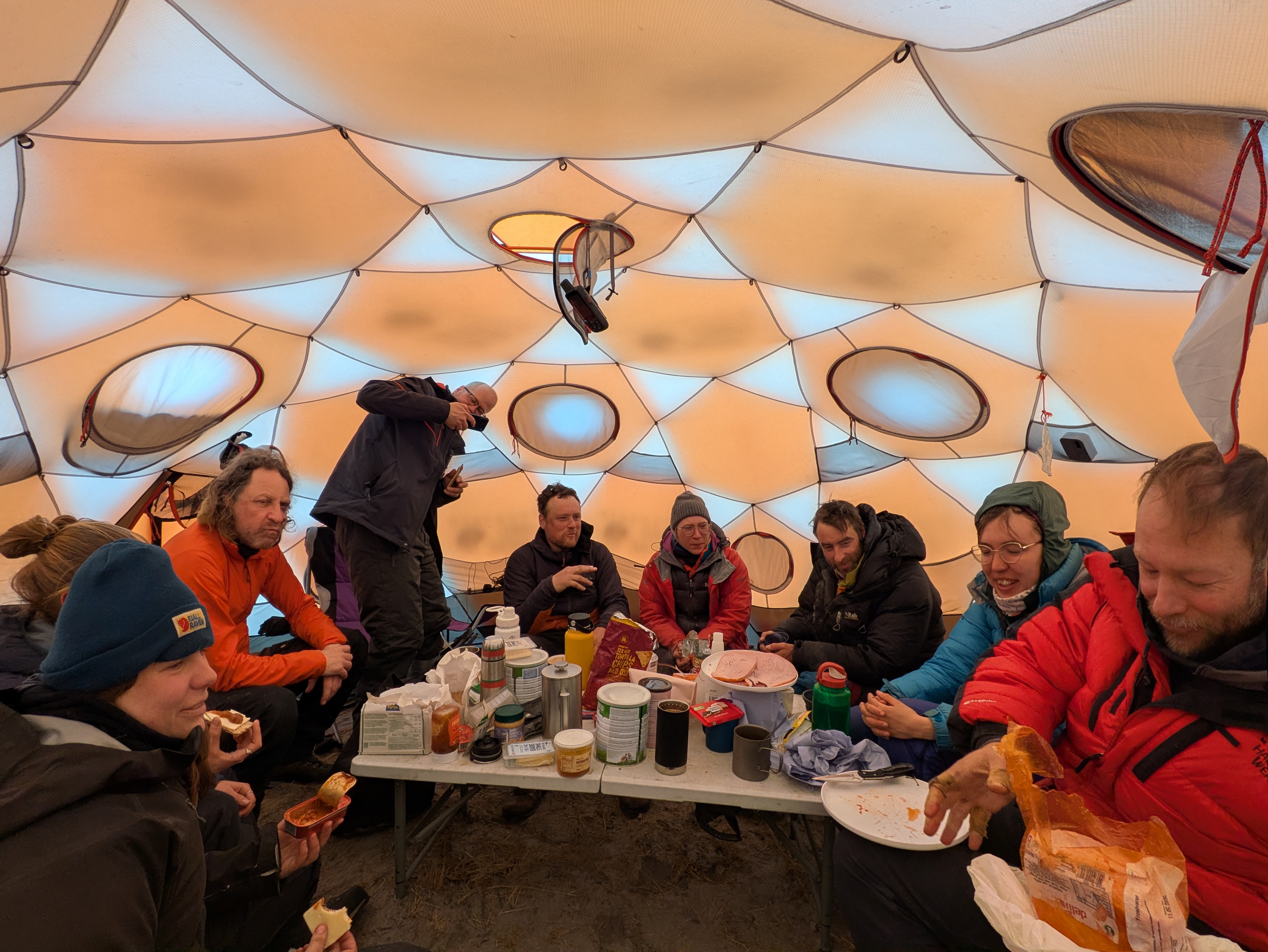 Sharing food and stories in the mess tent. (Photo: Liz Bagshaw)