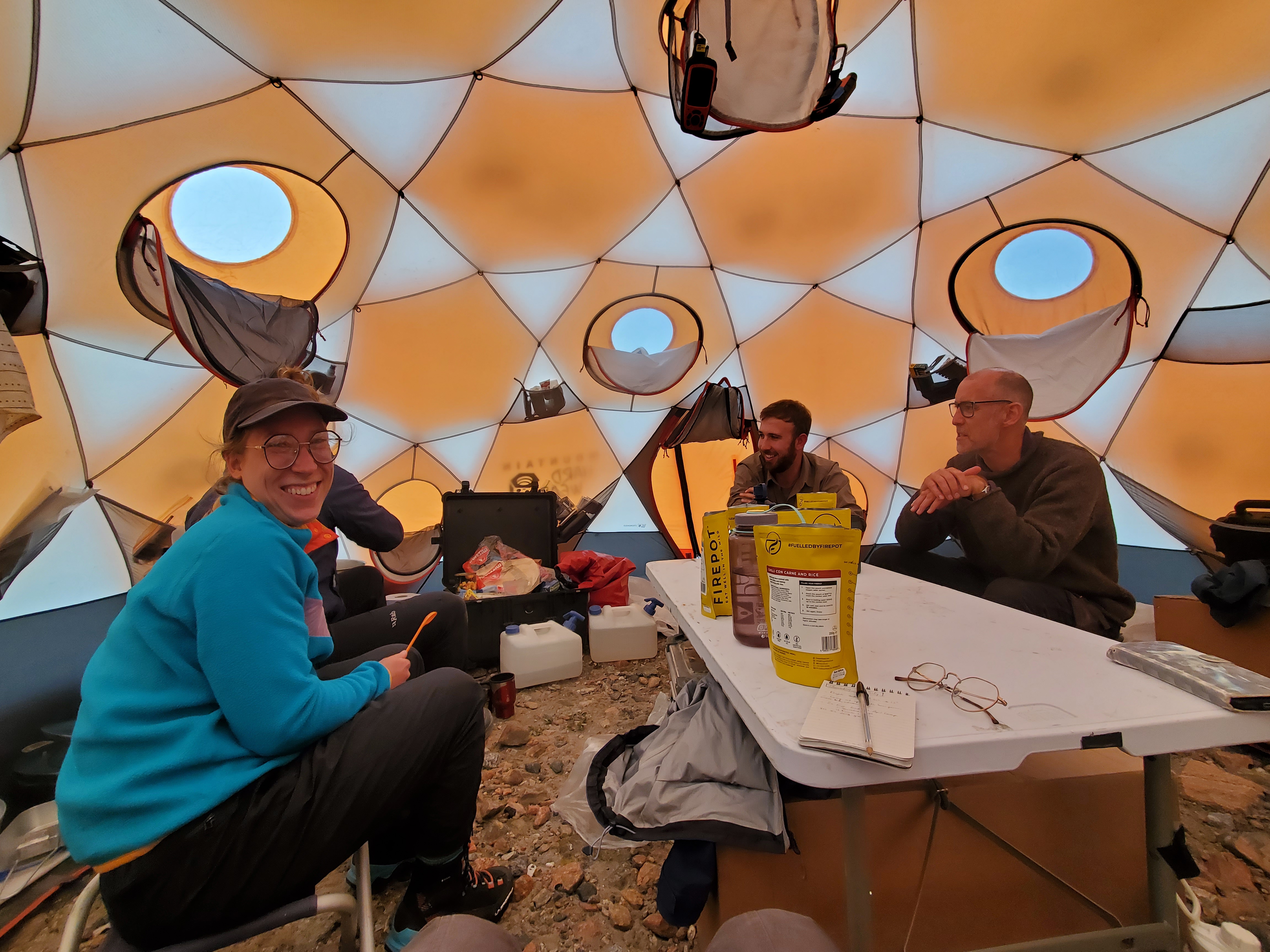 Team eating in the mess tent.